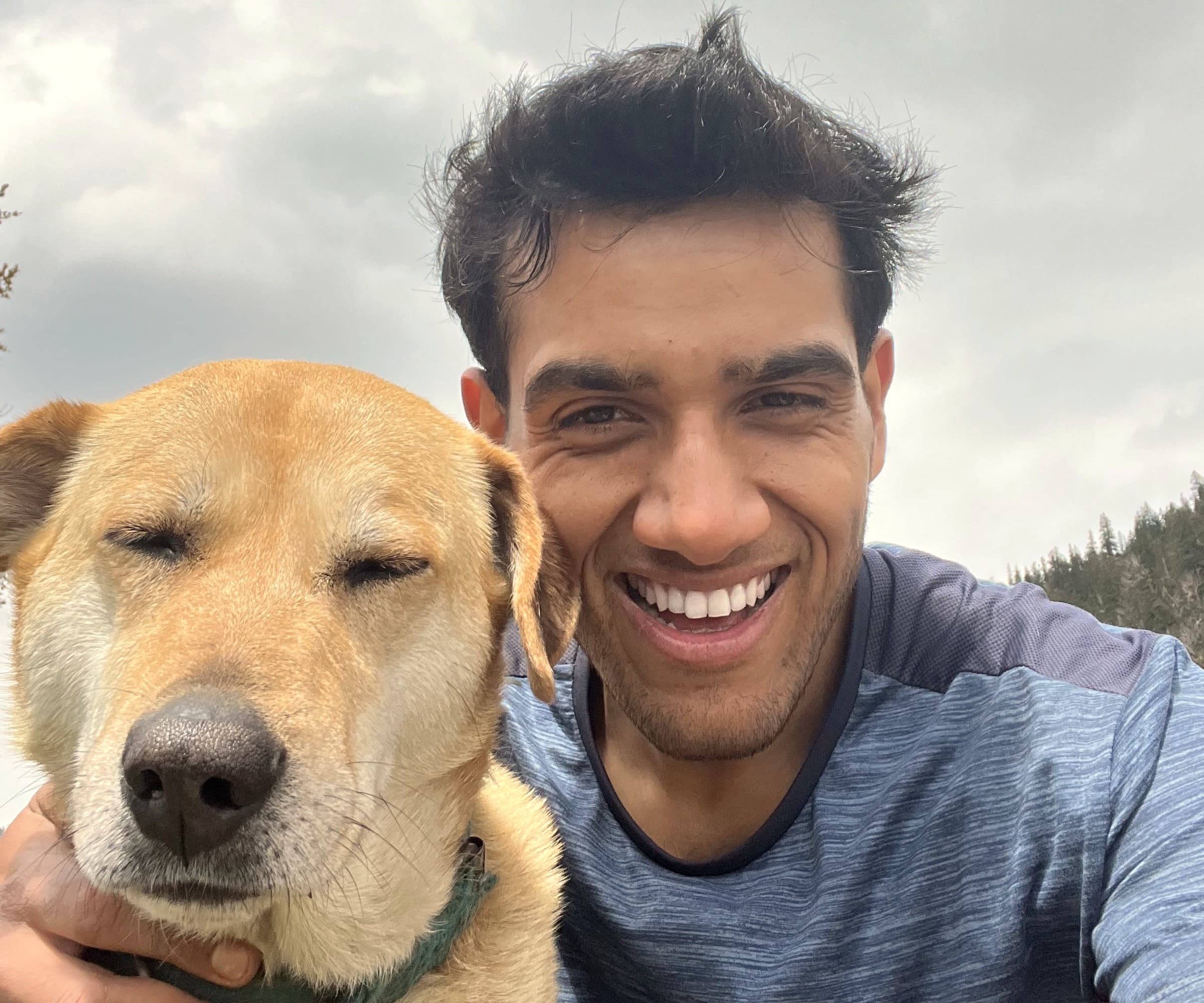 Akshit with James, his rescued Labrador, on a trail